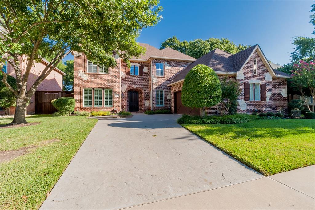 636 Deforest Road Coppell, TX 75019 - Photo 1 of 1 a front view of a house with a yard and potted plants