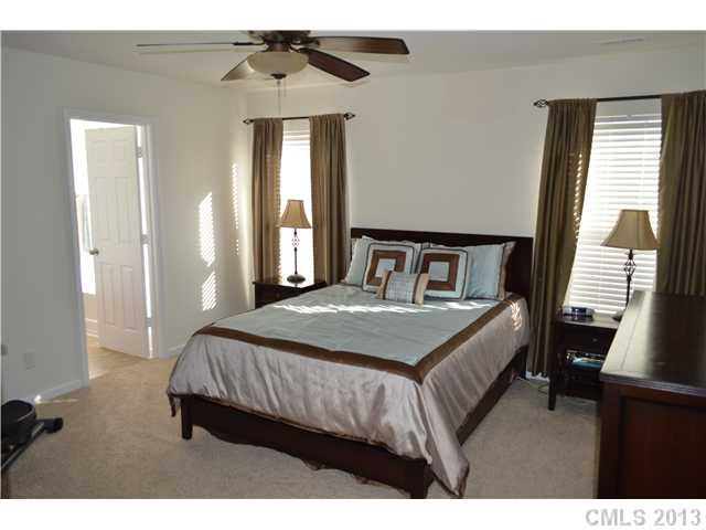 9227 Yellow Oak Road Charlotte, NC 28227 - Photo 11 of 16 a bedroom with a bed and window