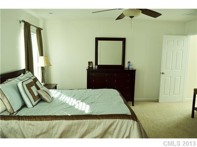 9227 Yellow Oak Road Charlotte, NC 28227 - Photo 12 of 16 a bedroom with a bed and a dresser