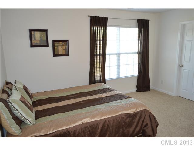 9227 Yellow Oak Road Charlotte, NC 28227 - Photo 14 of 16 a bedroom with a bed and a window