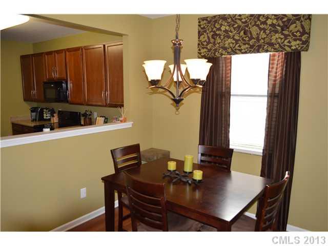 9227 Yellow Oak Road Charlotte, NC 28227 - Photo 5 of 16 a kitchen with a sink a window and cabinets