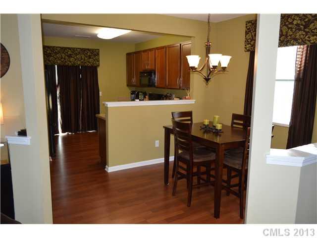 9227 Yellow Oak Road Charlotte, NC 28227 - Photo 6 of 16 a view of a dining room with furniture and wooden floor