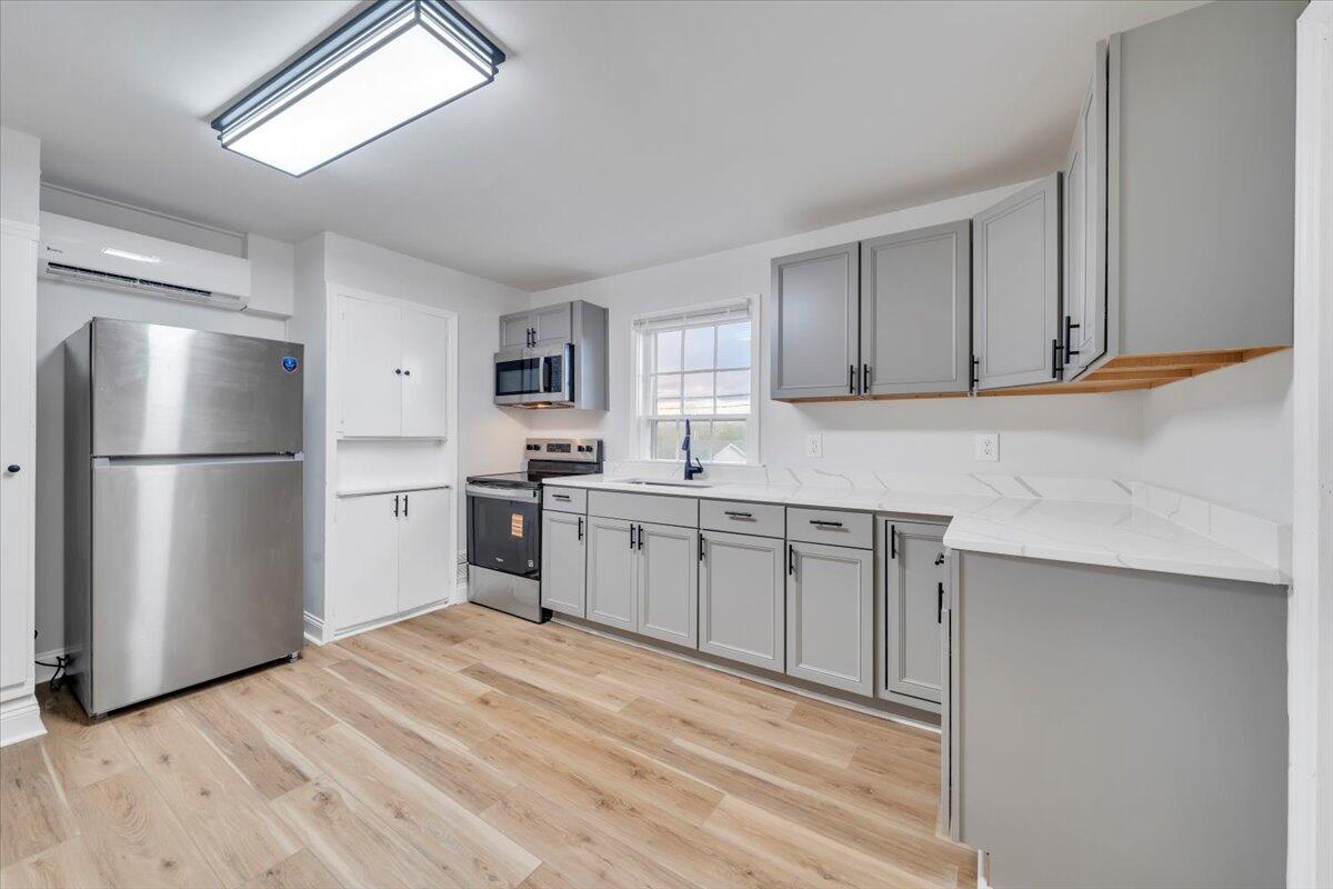 55 Black Feather Trail Ridgeway, VA 24148 - Photo 12 of 35 a kitchen with a refrigerator sink and cabinets