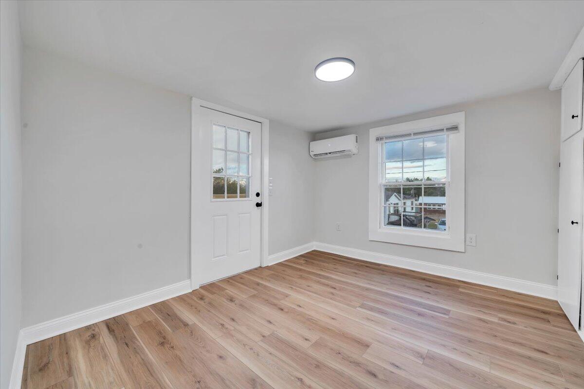 55 Black Feather Trail Ridgeway, VA 24148 - Photo 20 of 35 a view of an empty room with wooden floor and a window