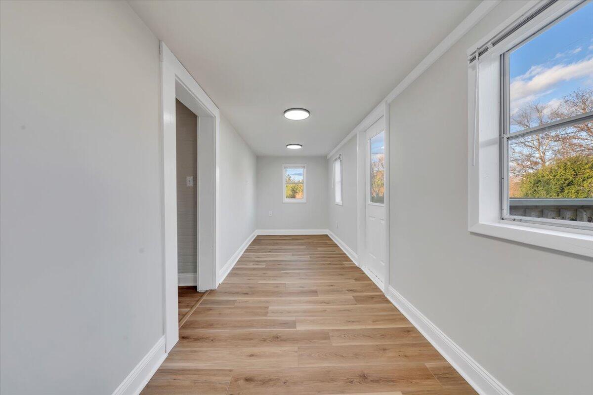 55 Black Feather Trail Ridgeway, VA 24148 - Photo 2 of 35 a view of a hallway with wooden floor and windows