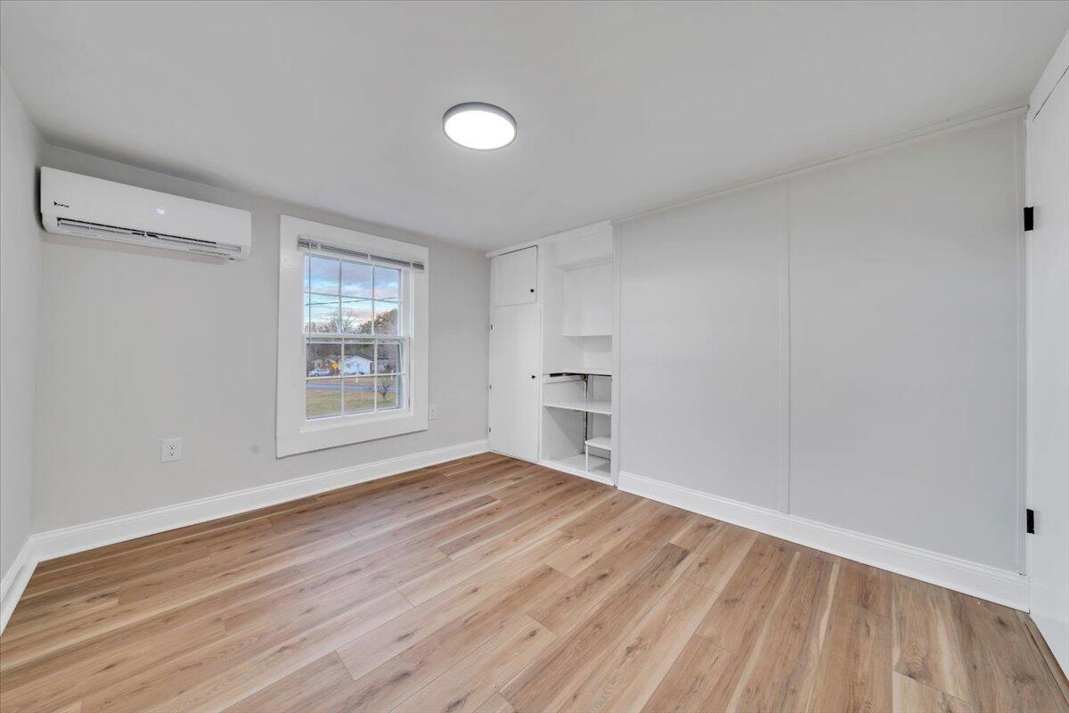 55 Black Feather Trail Ridgeway, VA 24148 - Photo 21 of 35 a view of empty room with wooden floor and fan