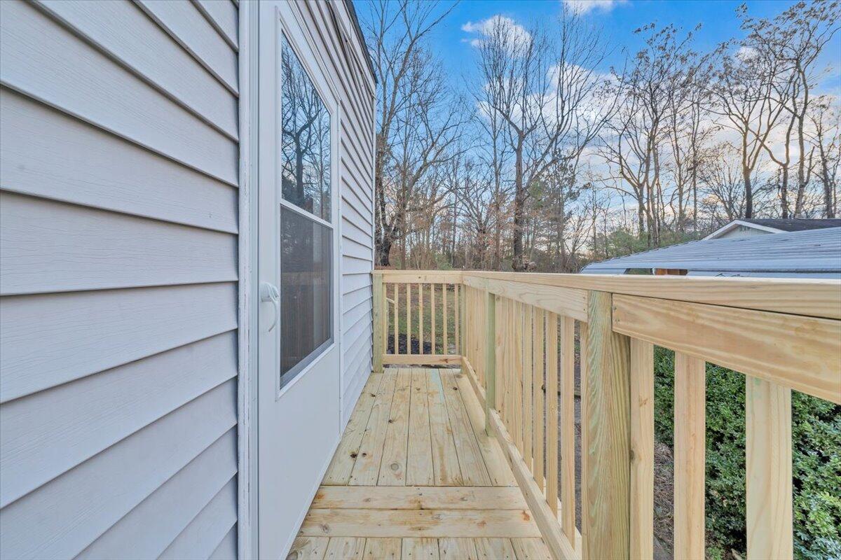 55 Black Feather Trail Ridgeway, VA 24148 - Photo 22 of 35 a view of a wooden house with a large window