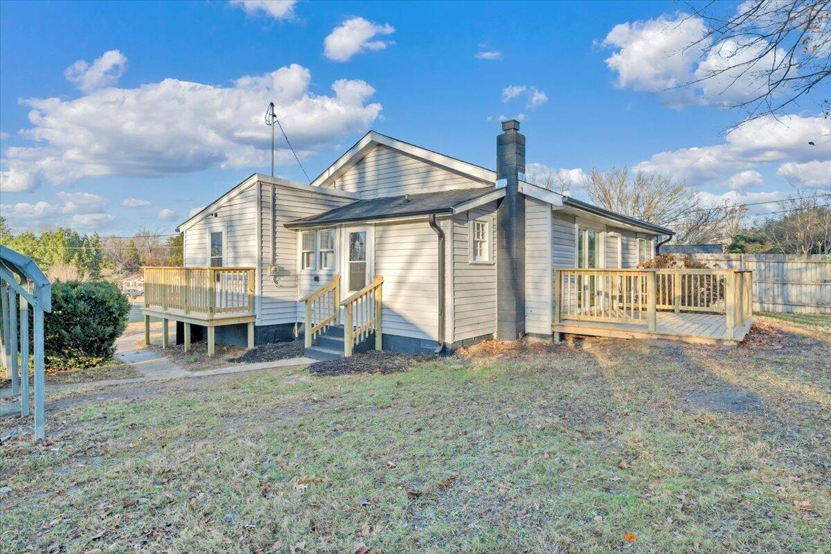 55 Black Feather Trail Ridgeway, VA 24148 - Photo 27 of 35 a view of a house with large windows and a yard