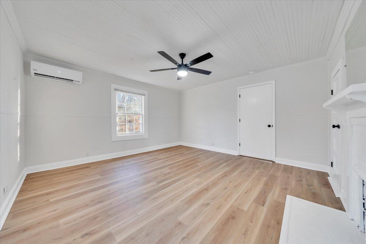 55 Black Feather Trail Ridgeway, VA 24148 - Photo 4 of 35 wooden floor in an empty room with a window