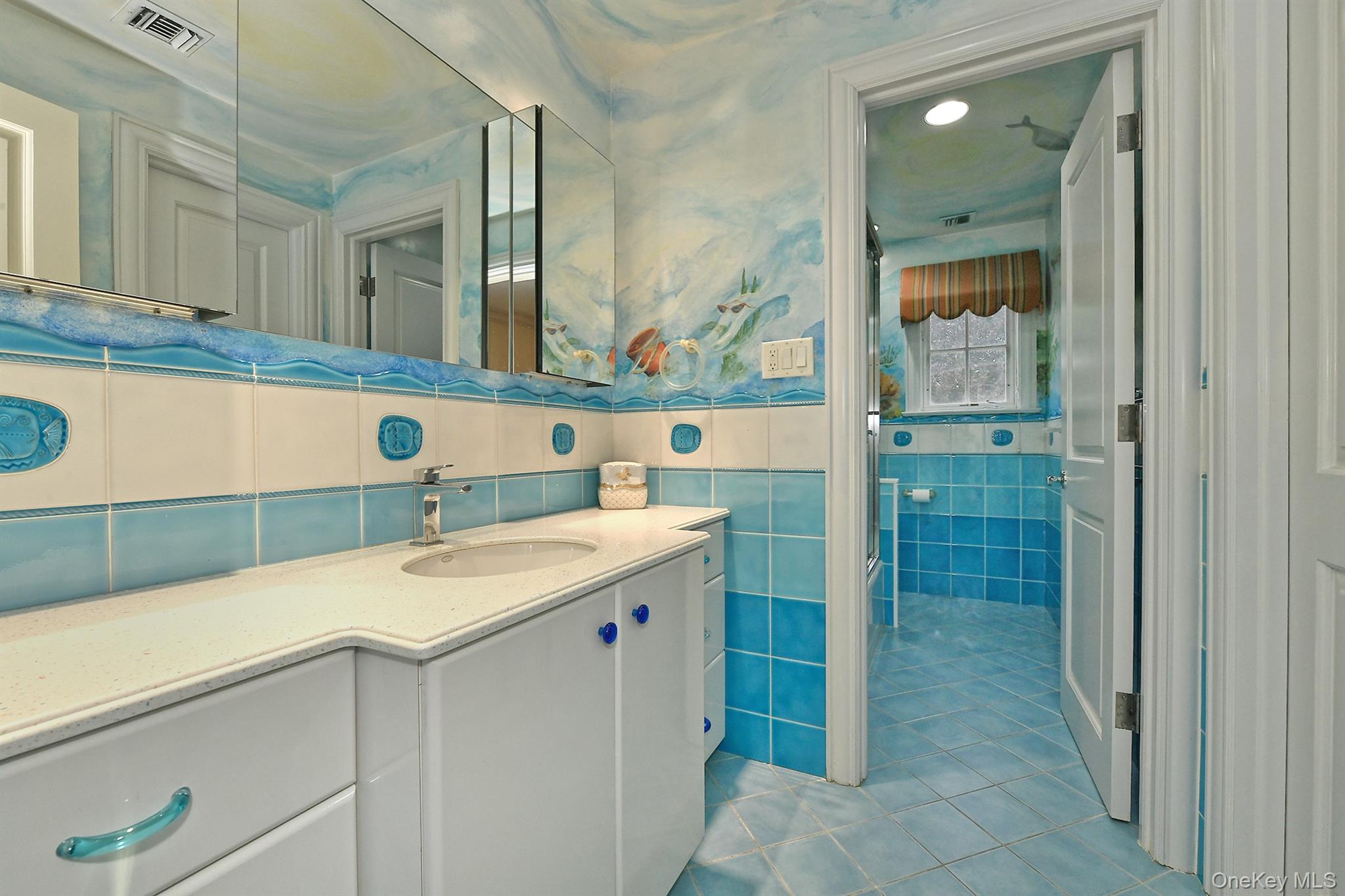 14 Norgate Road Glen Head, NY 11545 - Photo 26 of 44 a bathroom with a sink and a mirror
