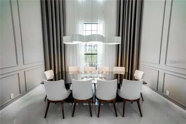 a view of a dining room with furniture and window