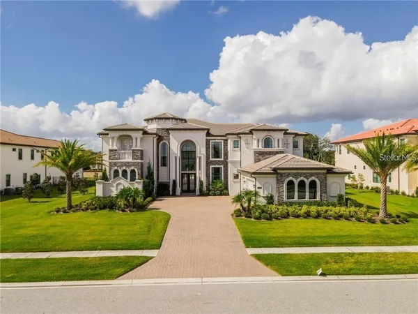 a front view of a house with a yard table and chairs