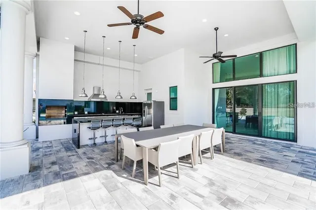 a large kitchen with a table and chairs