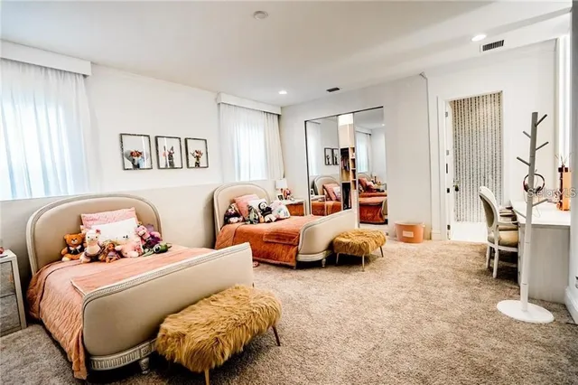 a bedroom with a bed and a couch