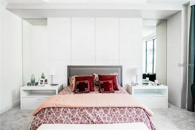 a bedroom with a bed and window