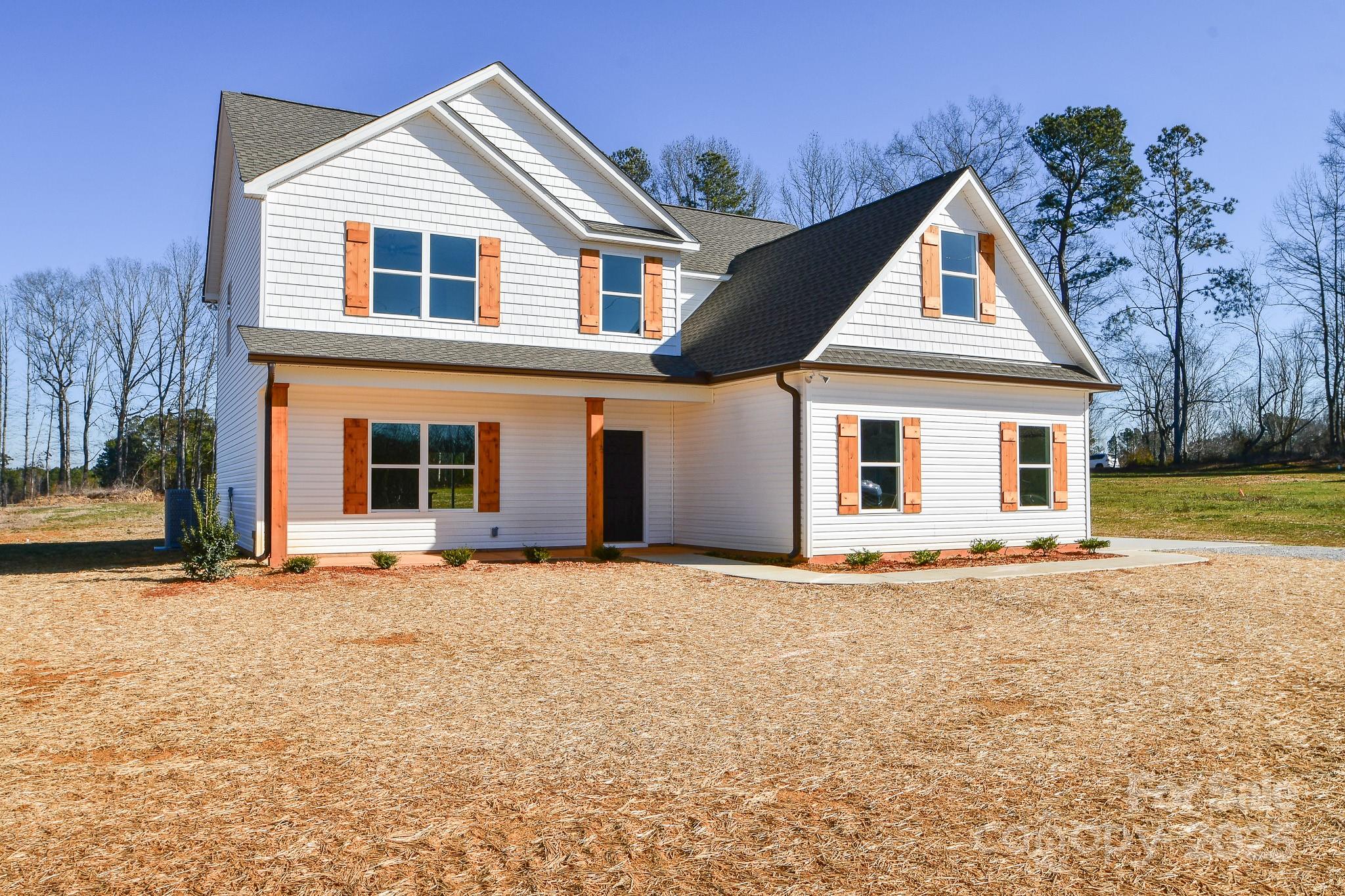 7805 Medlin Road Monroe, NC 28112 - Photo 2 of 13 a front view of a house with a yard