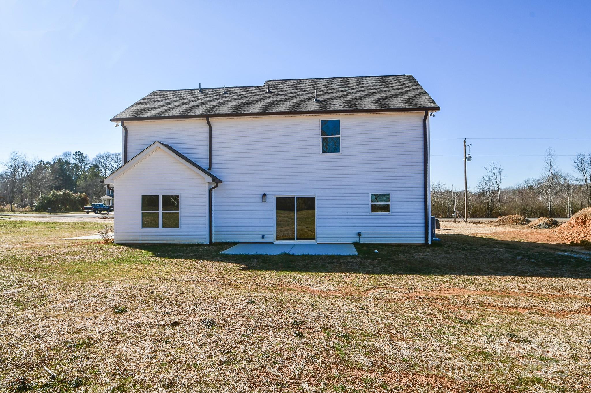 7805 Medlin Road Monroe, NC 28112 - Photo 4 of 13 a view of a house with a yard