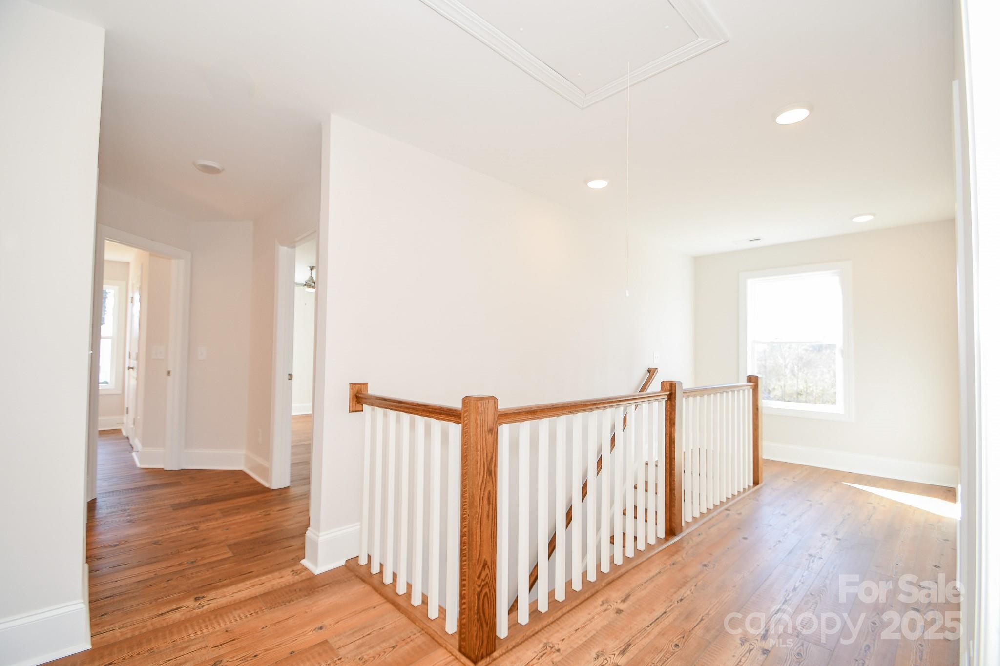 7805 Medlin Road Monroe, NC 28112 - Photo 10 of 13 a view of hallway with wooden floor