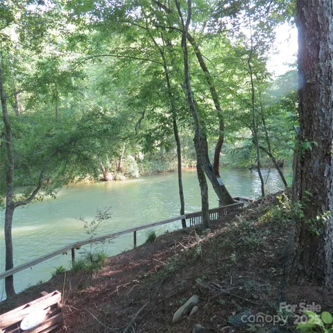 a view of lake with green space