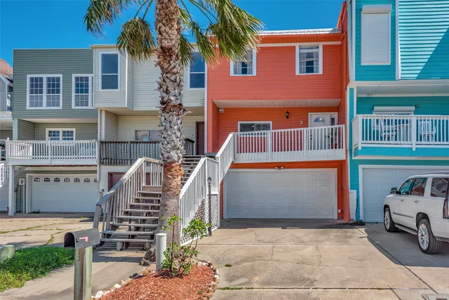 a front view of a house with stairway
