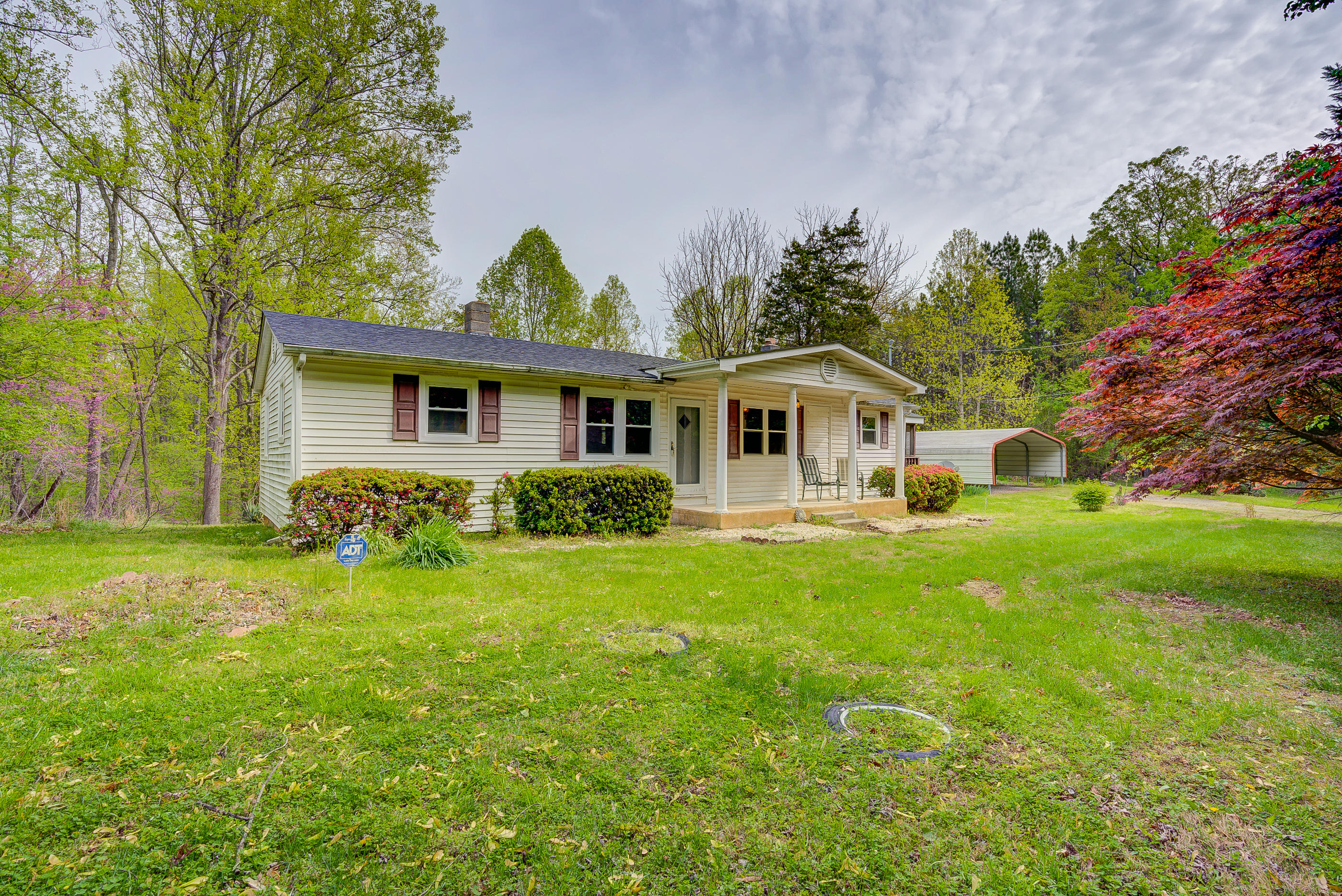 3110 Thomasson Mill Road Goodview, VA 24095 - Photo 1 of 35 a front view of house with yard and green space