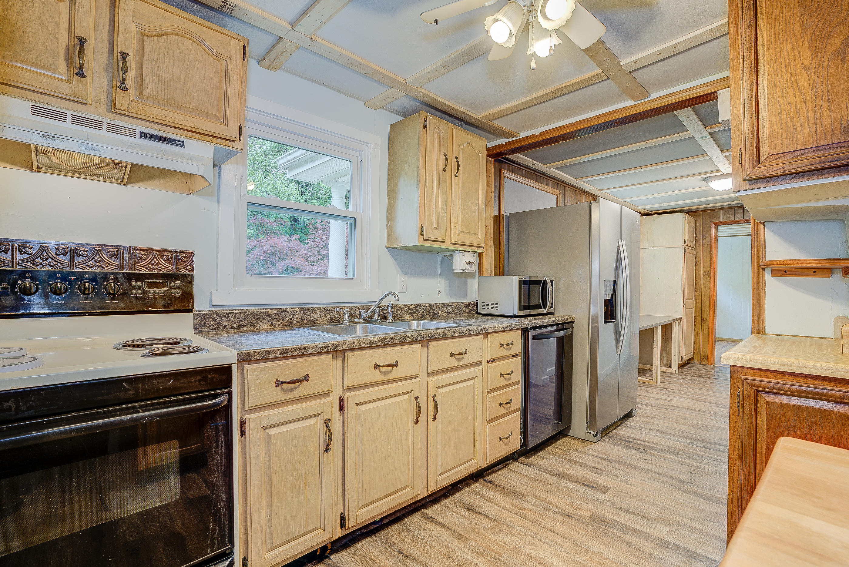 3110 Thomasson Mill Road Goodview, VA 24095 - Photo 13 of 35 a kitchen with granite countertop cabinets stainless steel appliances and a counter space