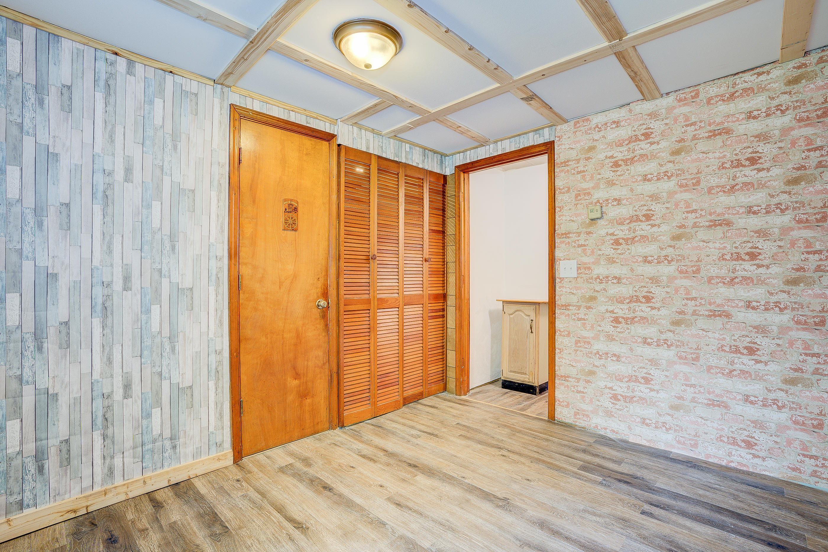 3110 Thomasson Mill Road Goodview, VA 24095 - Photo 19 of 35 a view of empty room with wooden floor and fan
