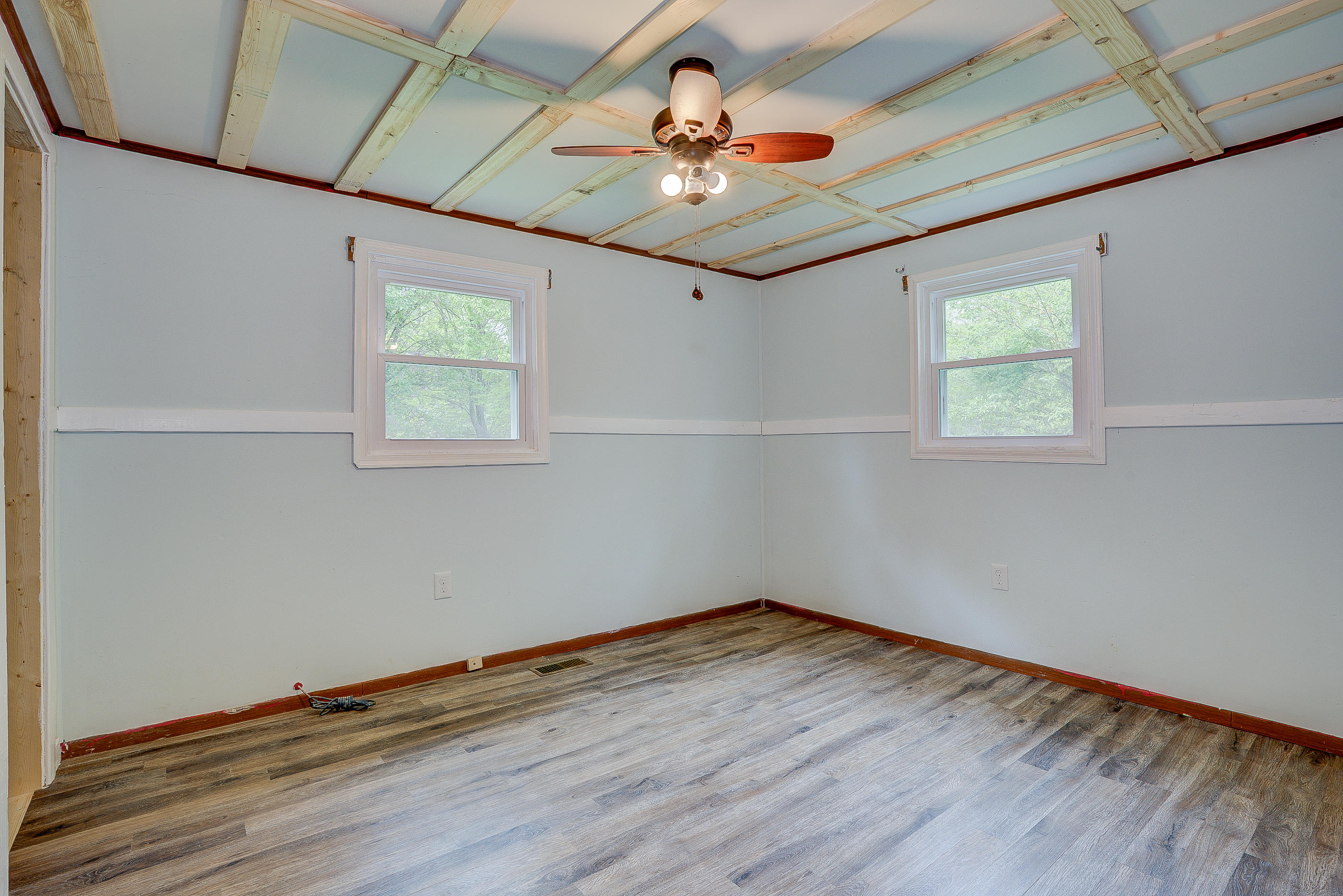 3110 Thomasson Mill Road Goodview, VA 24095 - Photo 25 of 35 a room with wooden floor and windows