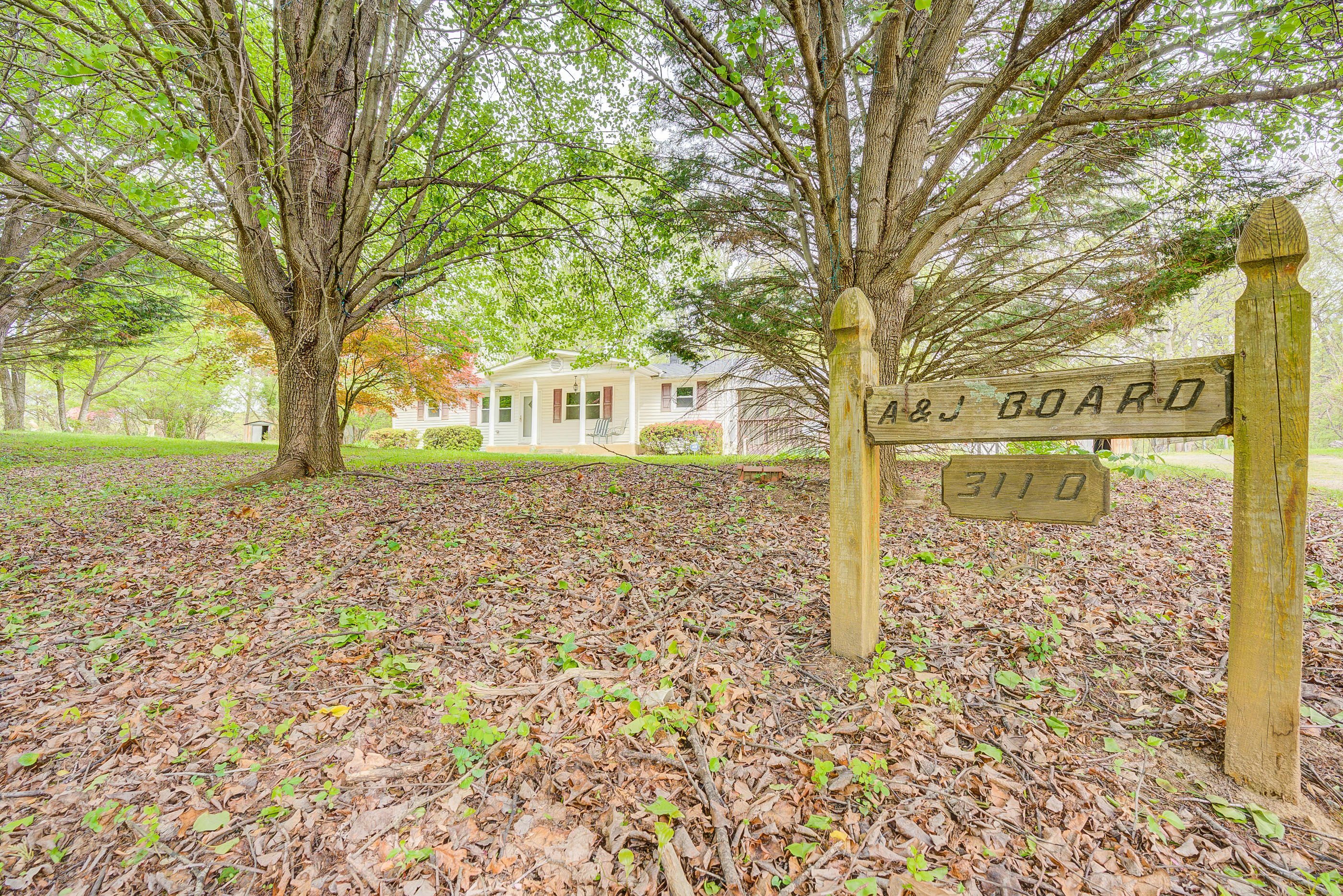 3110 Thomasson Mill Road Goodview, VA 24095 - Photo 27 of 35 a front view of a house with garden