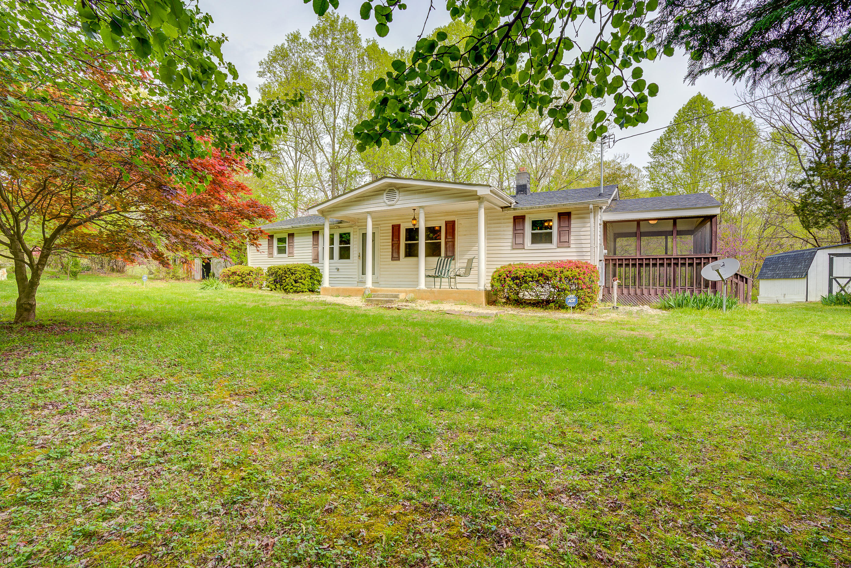 3110 Thomasson Mill Road Goodview, VA 24095 - Photo 30 of 35 a front view of a house with garden