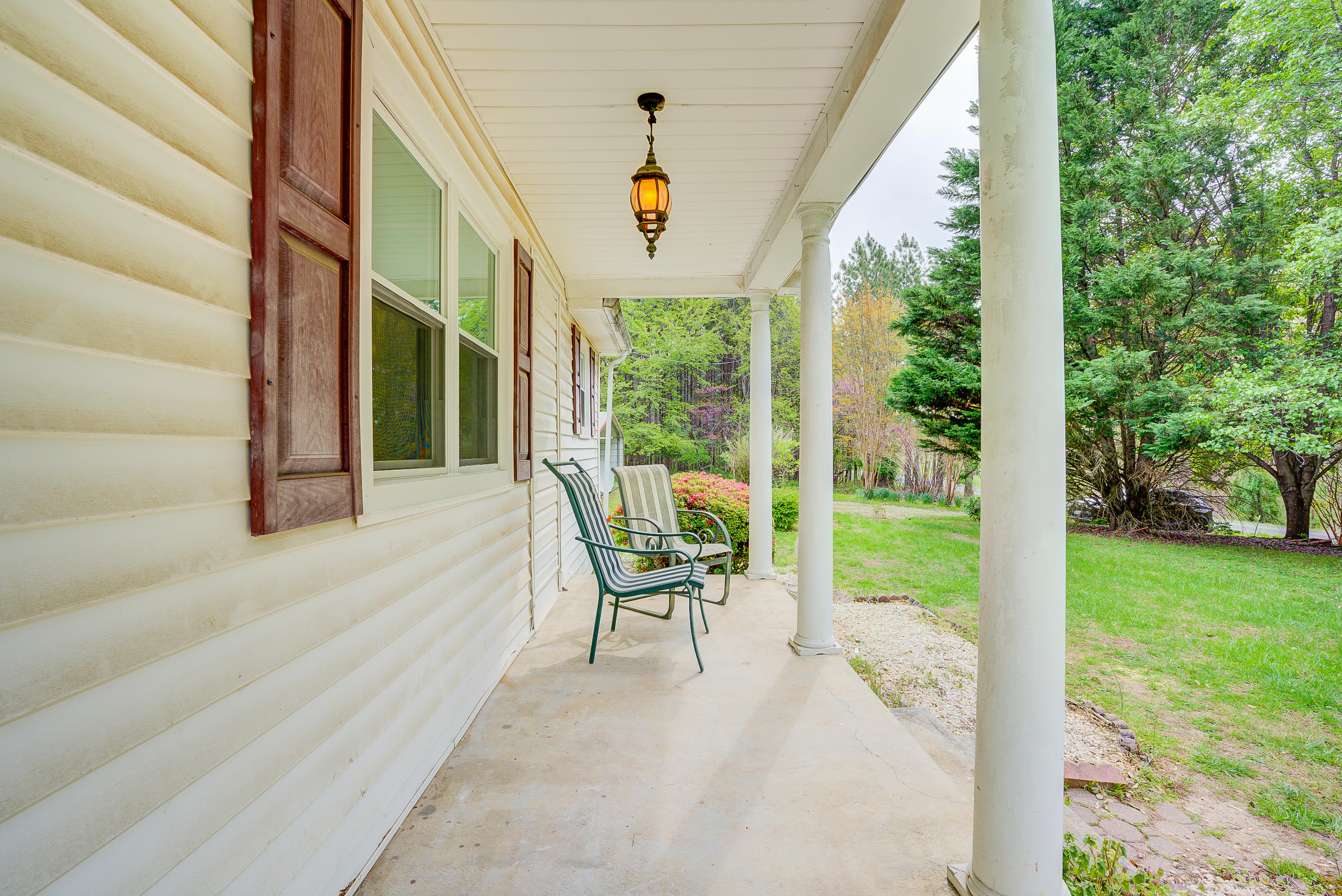3110 Thomasson Mill Road Goodview, VA 24095 - Photo 4 of 35 a balcony with furniture and garden view