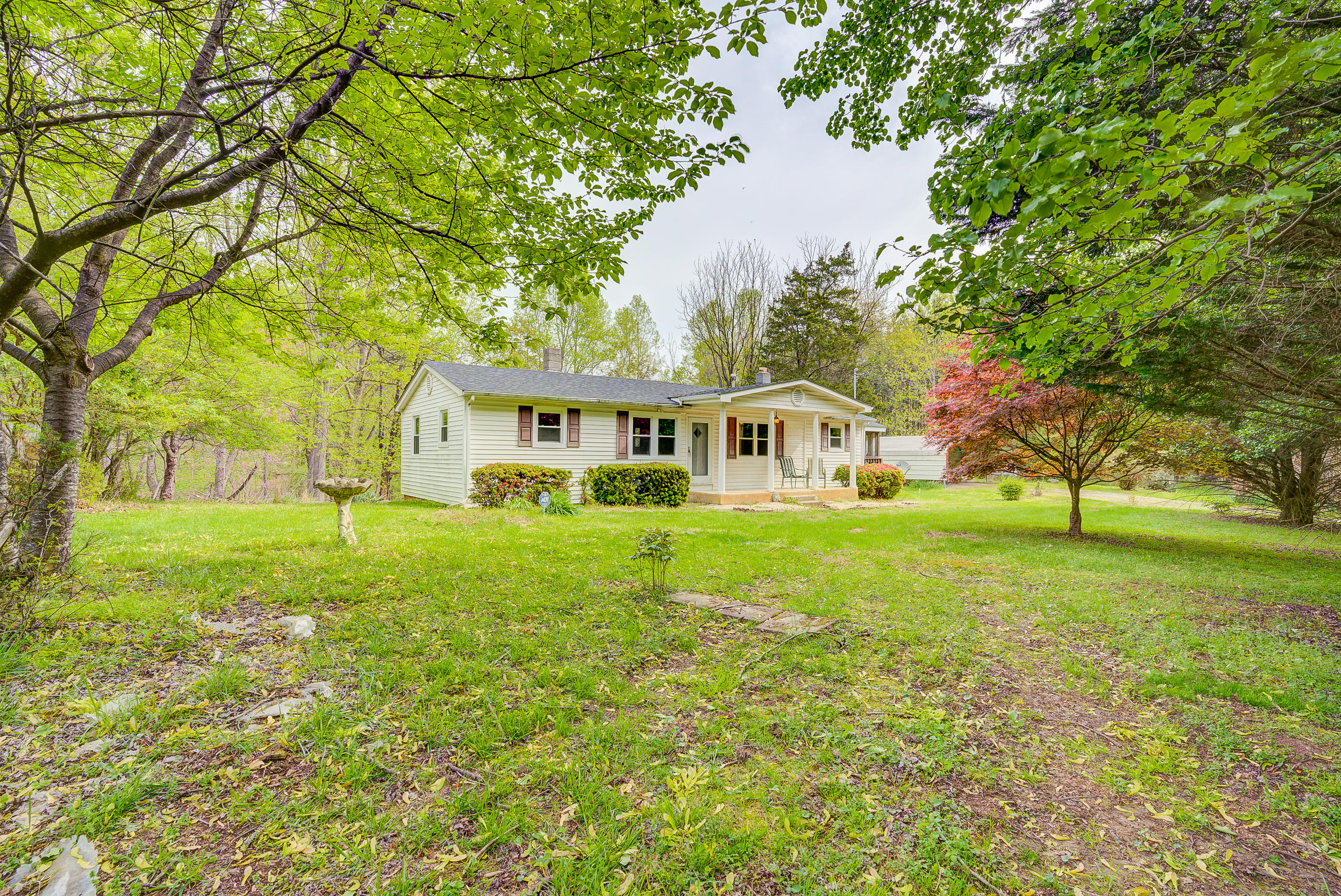 3110 Thomasson Mill Road Goodview, VA 24095 - Photo 32 of 35 a front view of a house with garden