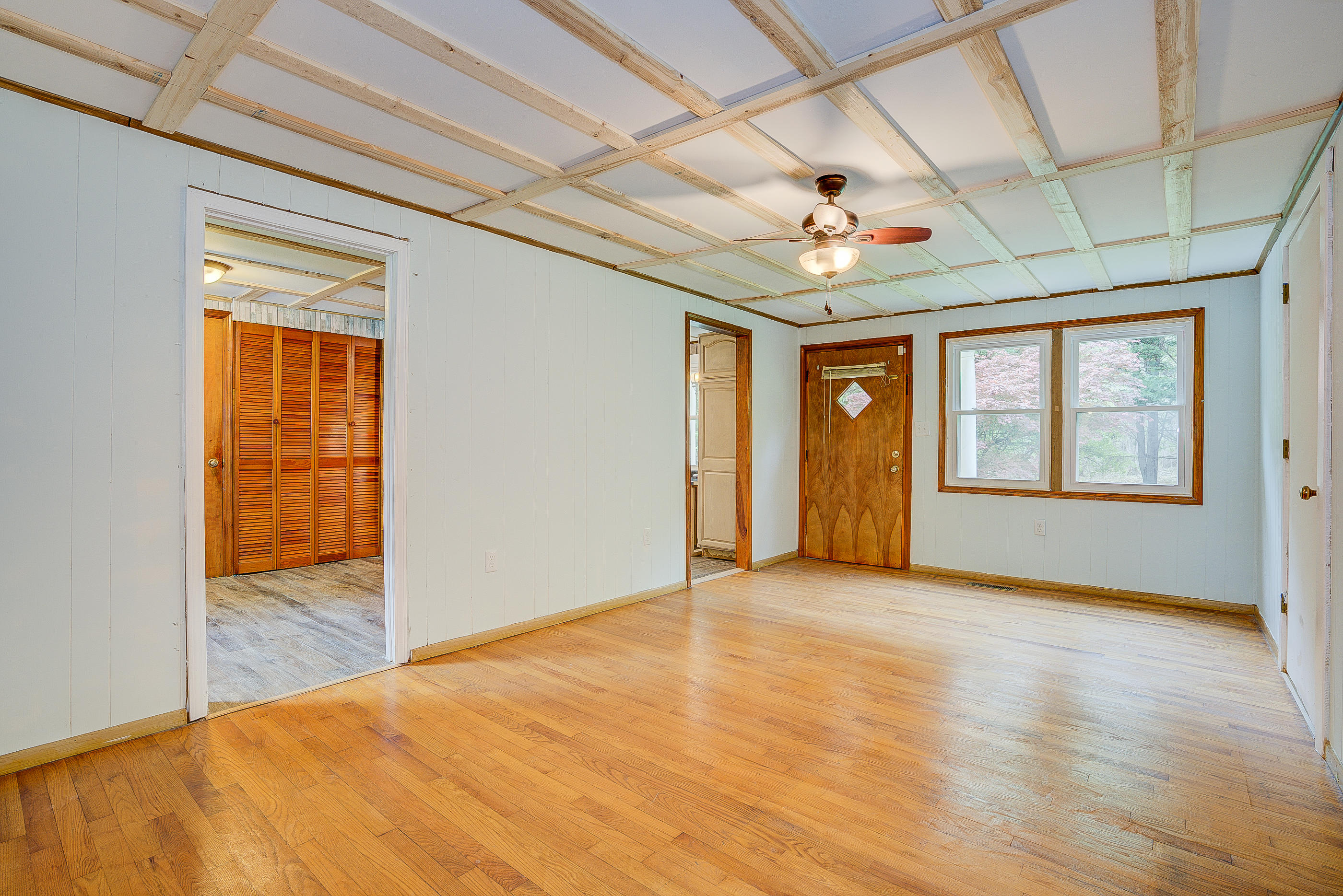3110 Thomasson Mill Road Goodview, VA 24095 - Photo 5 of 35 a view of an empty room with window and chandelier fan