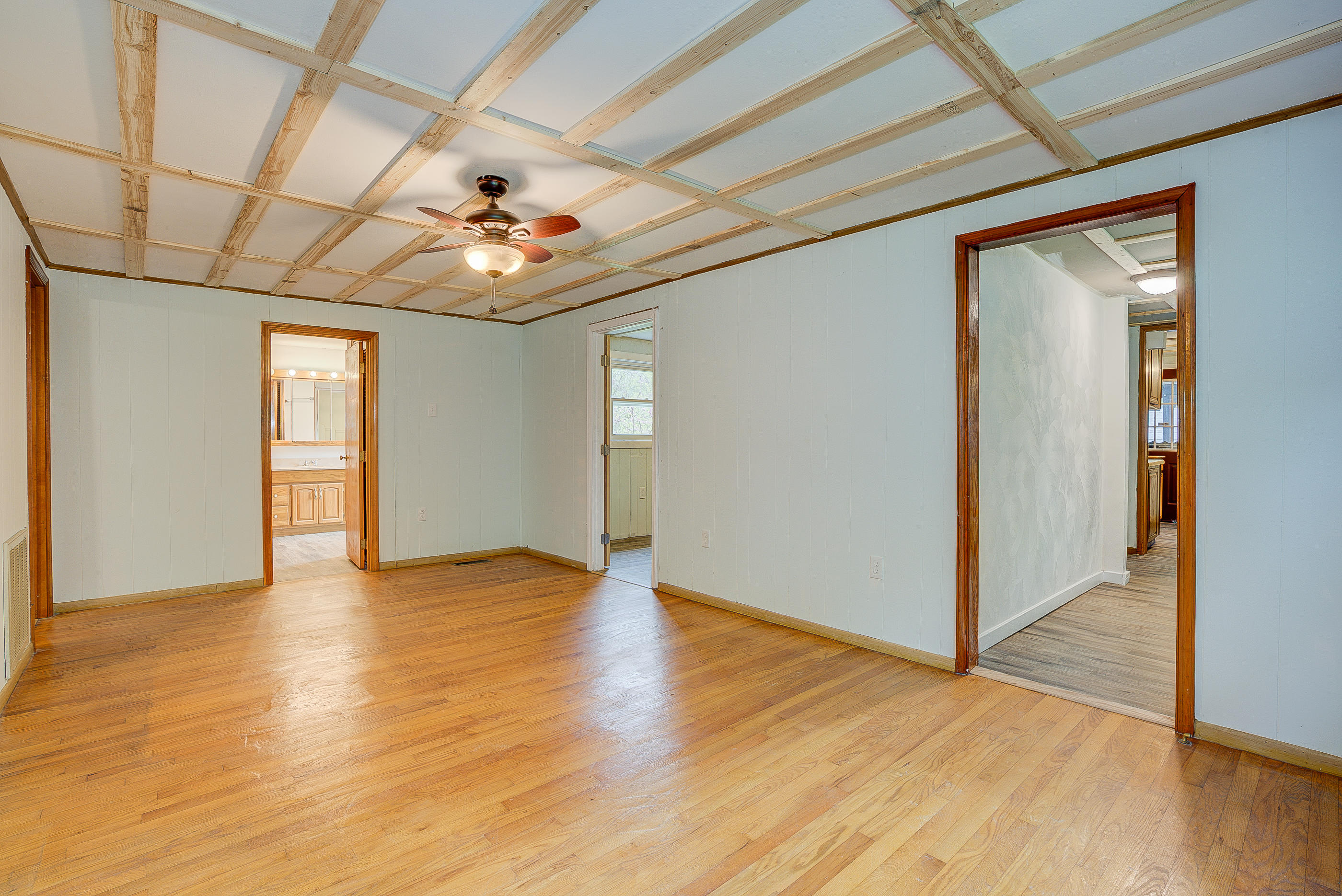 3110 Thomasson Mill Road Goodview, VA 24095 - Photo 8 of 35 a view of an empty room with window and wooden floor