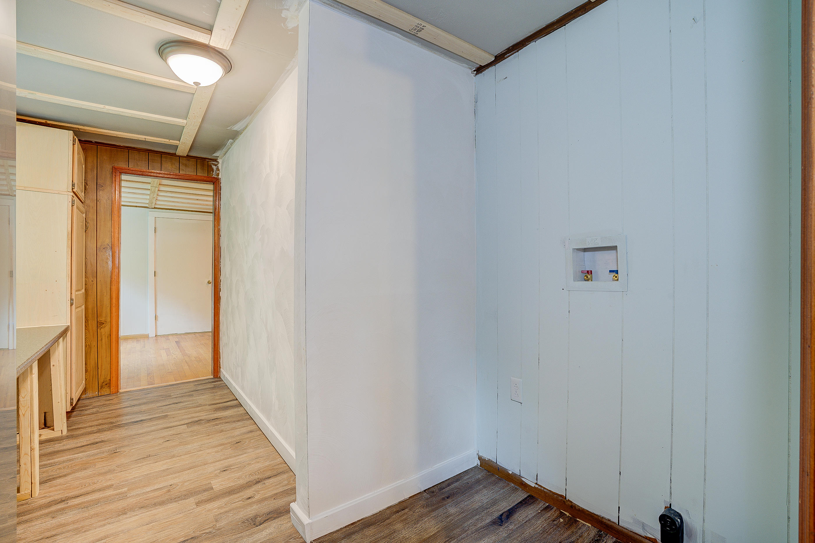 3110 Thomasson Mill Road Goodview, VA 24095 - Photo 10 of 35 a view of a hallway with wooden floor