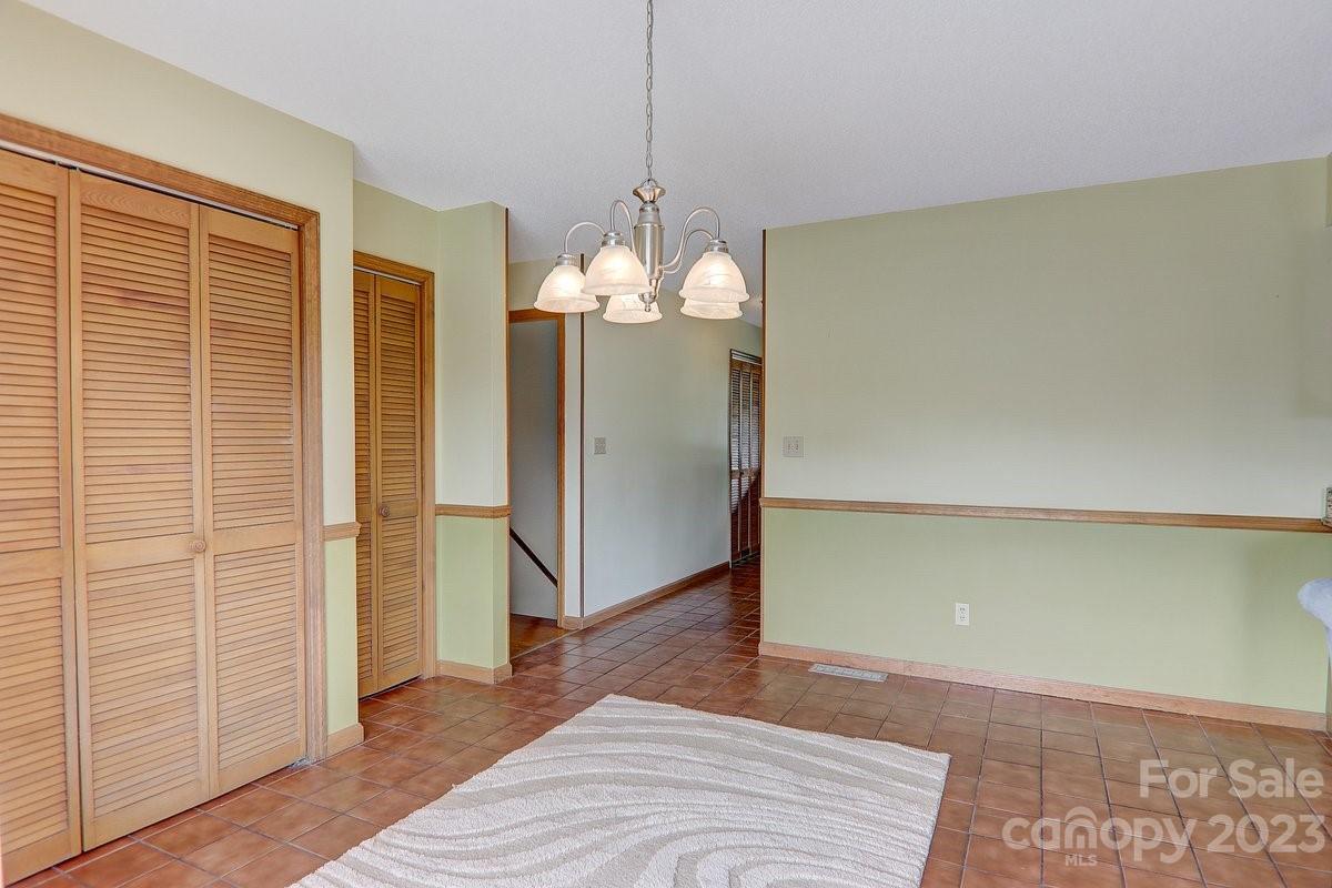 110 Oak Hill Road Candler, NC 28715 - Photo 11 of 37 a view of a livingroom with wooden floor and staircase