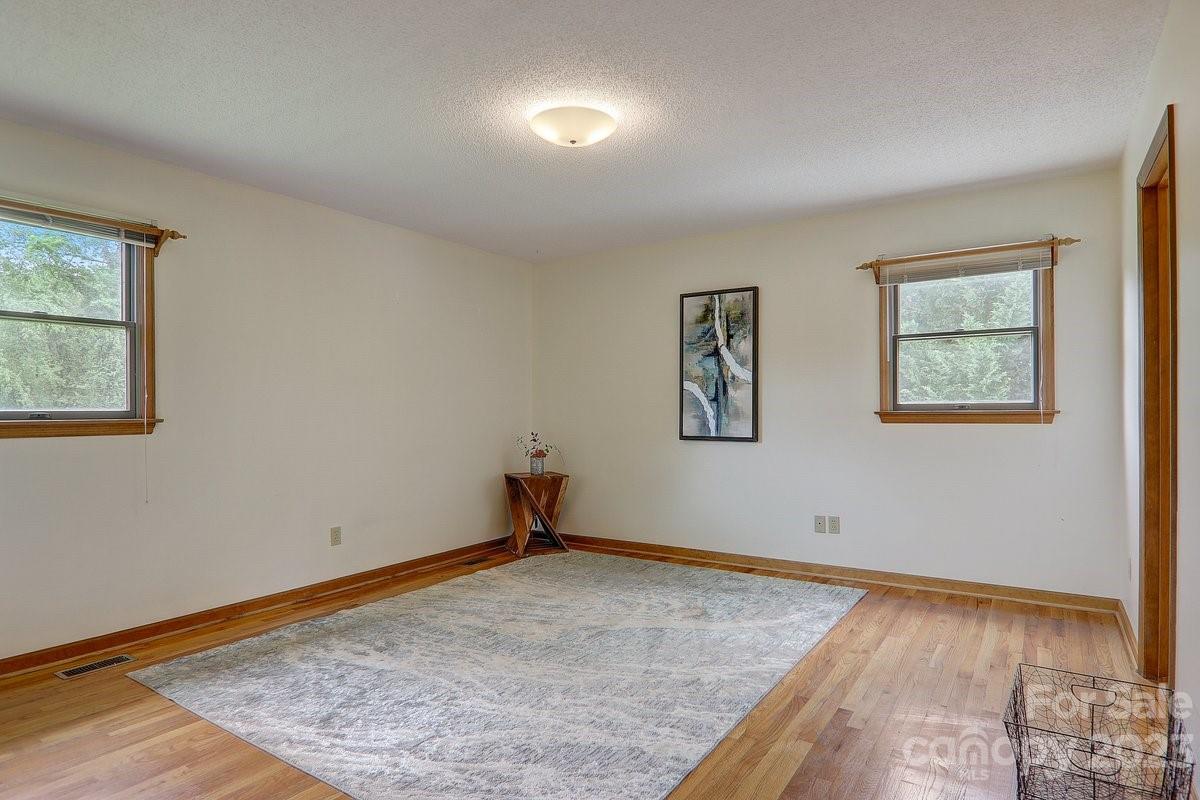 110 Oak Hill Road Candler, NC 28715 - Photo 15 of 37 a view of empty room with wooden floor