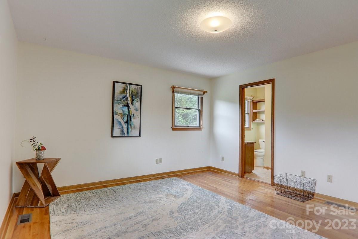 110 Oak Hill Road Candler, NC 28715 - Photo 16 of 37 an empty room with windows and closet