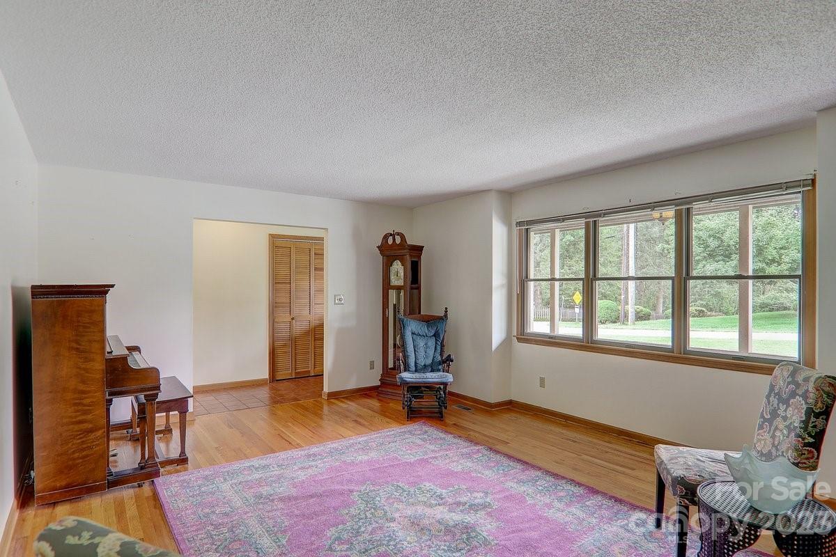 110 Oak Hill Road Candler, NC 28715 - Photo 19 of 37 a living room with furniture and a window