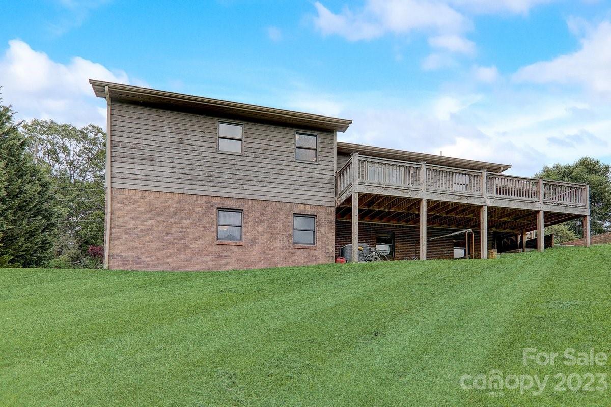 110 Oak Hill Road Candler, NC 28715 - Photo 22 of 37 a view of a house with a yard