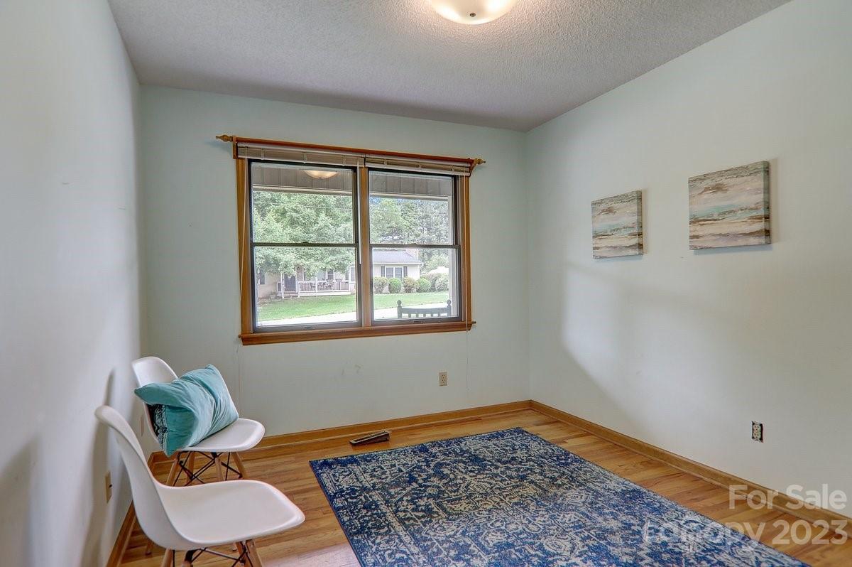 110 Oak Hill Road Candler, NC 28715 - Photo 23 of 37 a room with a couch and a rug