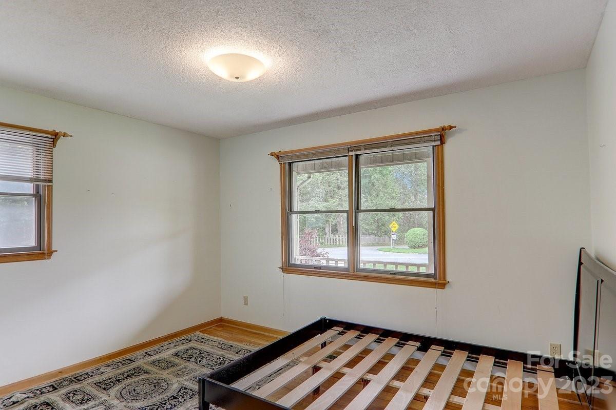 110 Oak Hill Road Candler, NC 28715 - Photo 24 of 37 a view of an empty room with a window
