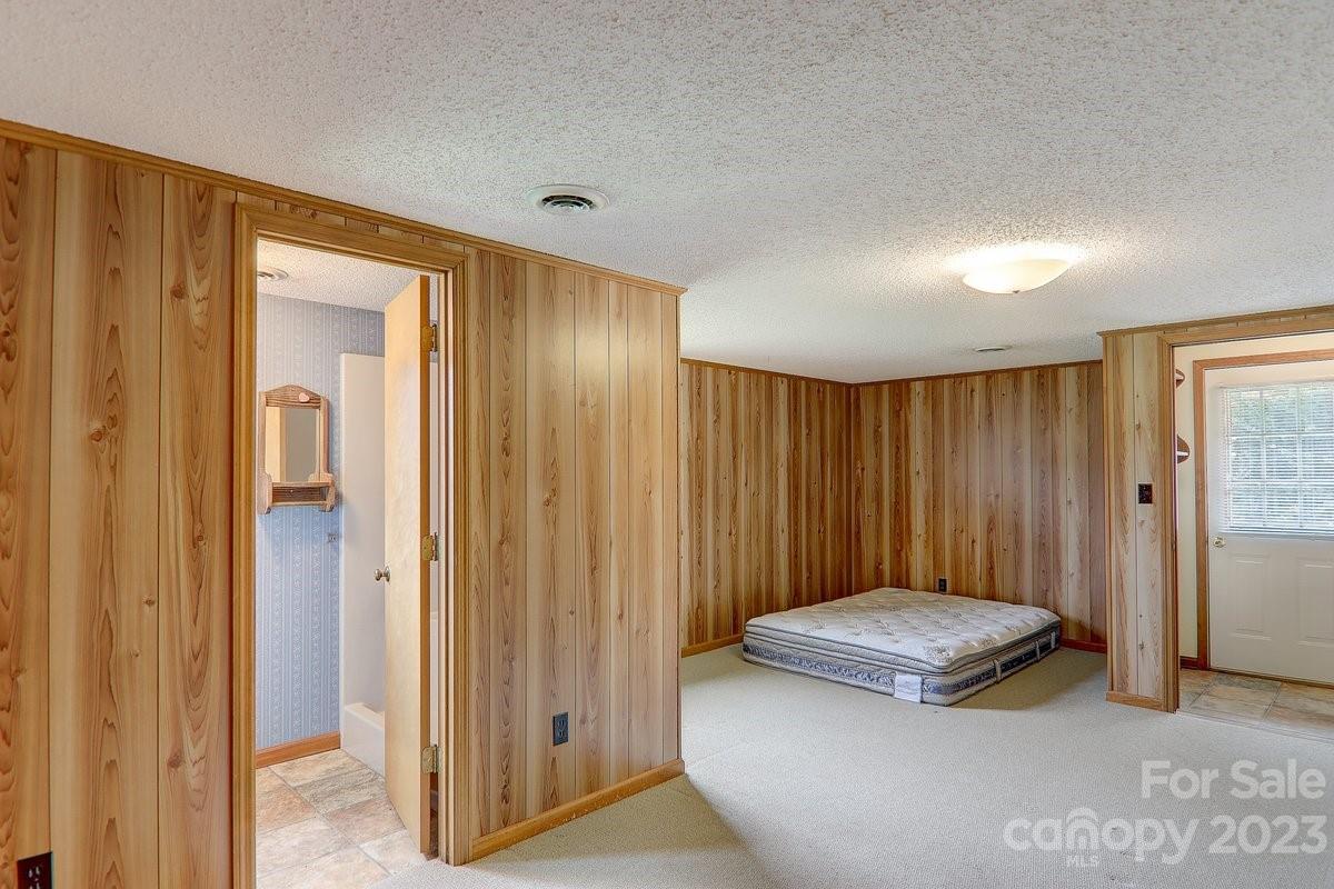 110 Oak Hill Road Candler, NC 28715 - Photo 31 of 37 a view of a bathroom with a tub and shower curtain