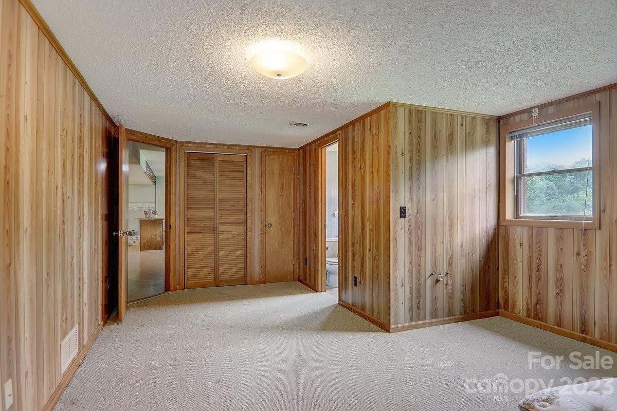110 Oak Hill Road Candler, NC 28715 - Photo 32 of 37 a view of an empty room with a window