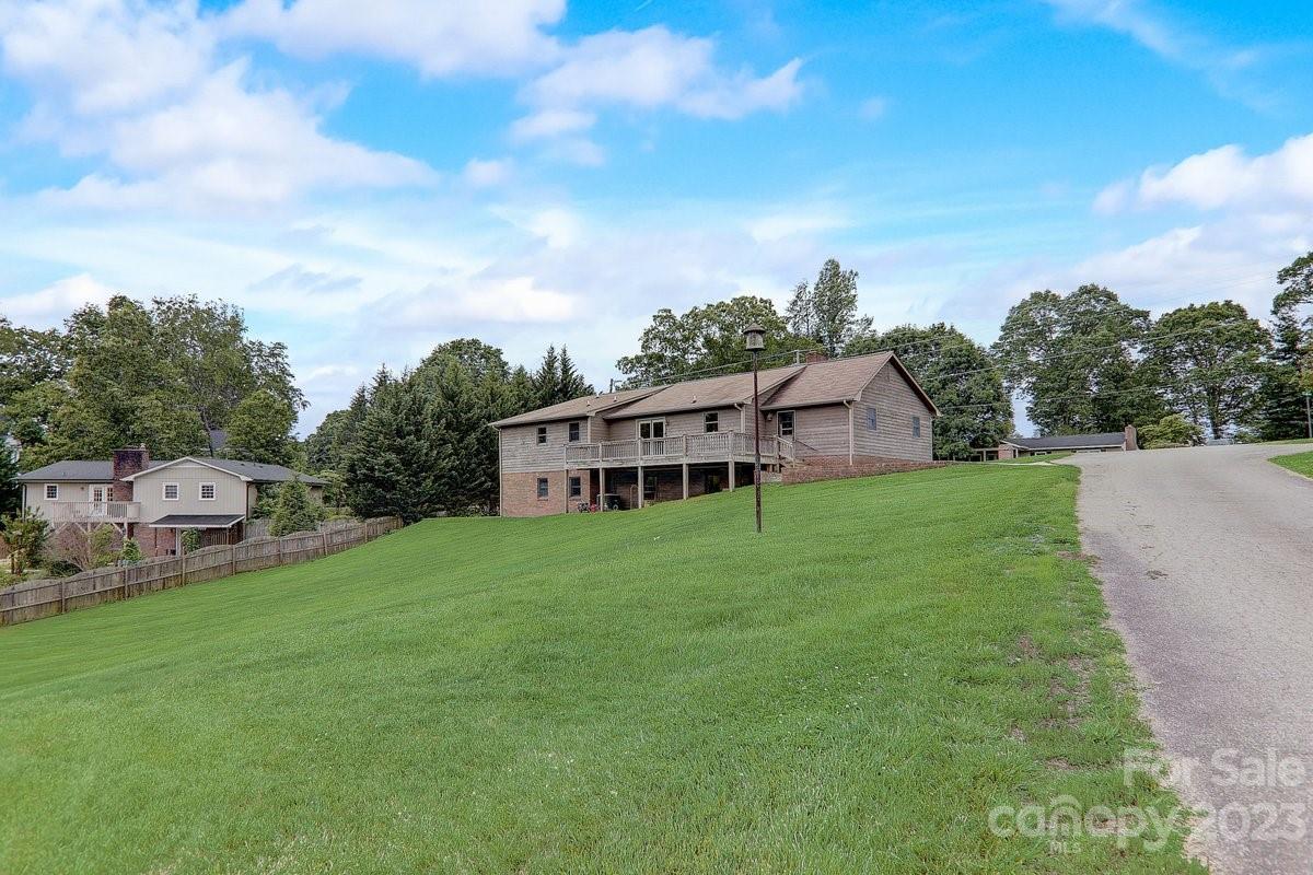 110 Oak Hill Road Candler, NC 28715 - Photo 6 of 37 a view of a house with backyard and garden