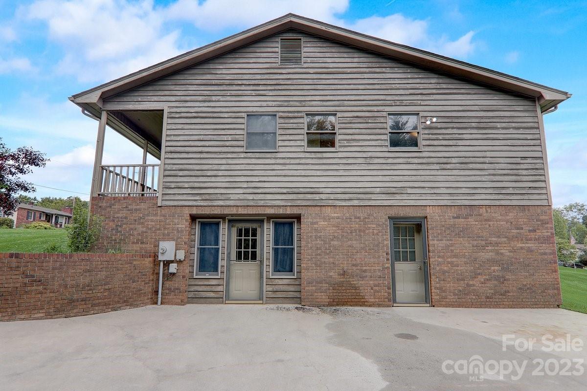 110 Oak Hill Road Candler, NC 28715 - Photo 8 of 37 a front view of a house with garage
