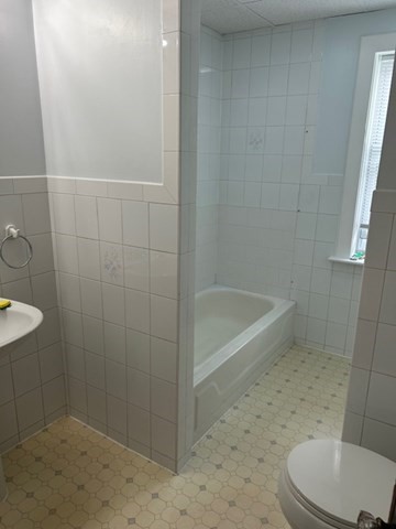 7 Ridgeland Road, Unit 1 Shrewsbury, MA 01545 - Photo 16 of 20 a bathroom with a sink a toilet and shower