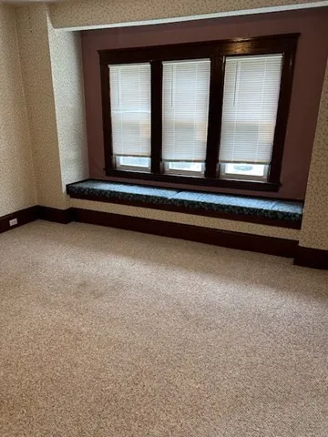 a view of backyard with a large window