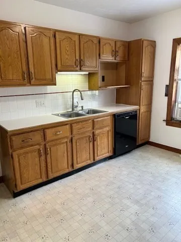 a kitchen with stainless steel appliances granite countertop a refrigerator sink and cabinets