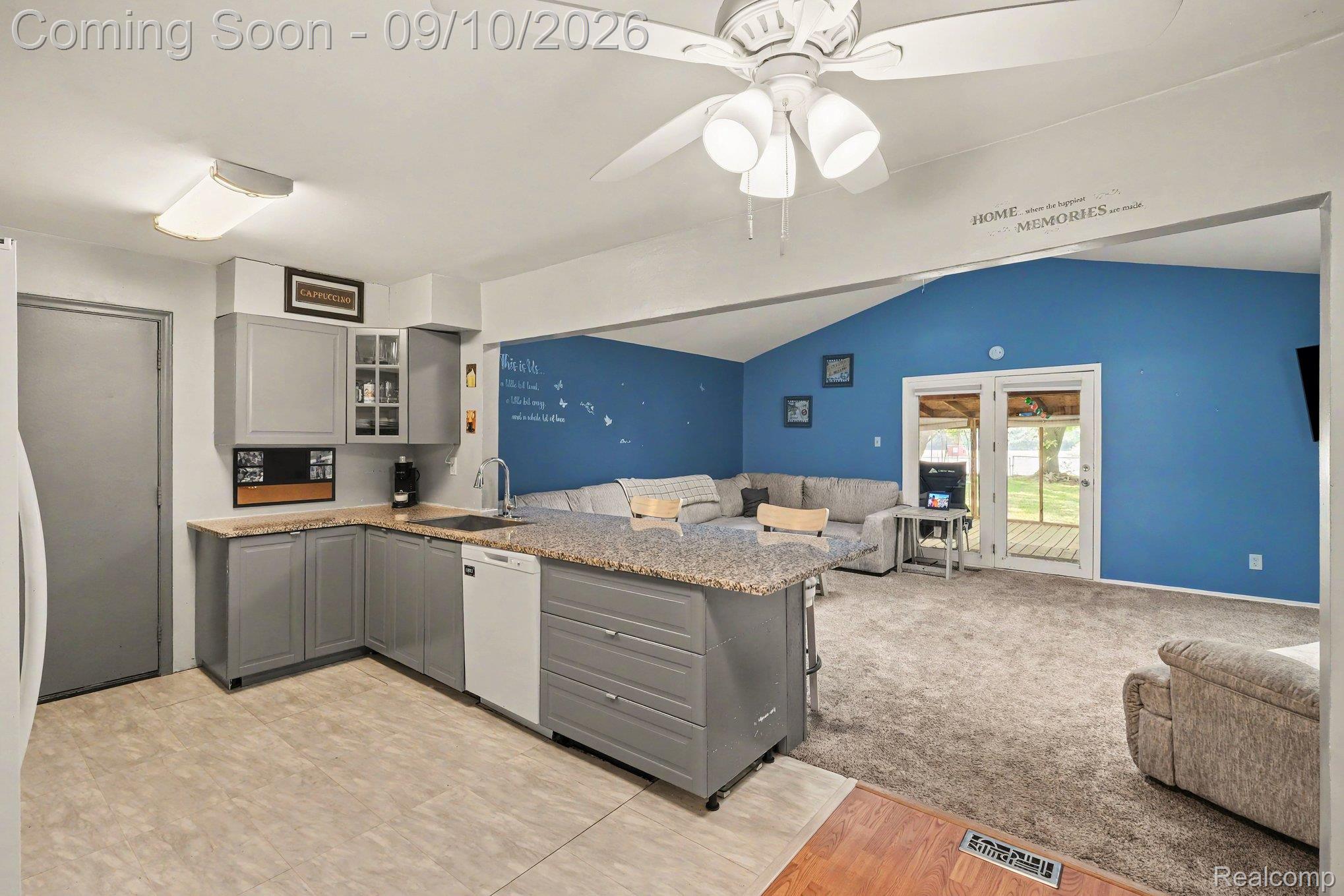 4338 Crosby Road Flint, MI 48506 - Photo 3 of 16 Kitchen featuring gray cabinetry, granite-style countertops, and a built-in dishwasher